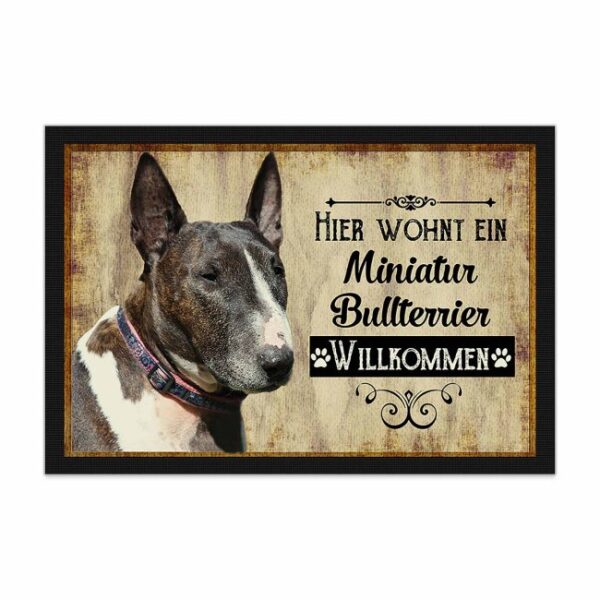 Wunderschöne Fußmatte mit Hundespruch - Hier wohnt ein Miniatur Bullterrier. Eine besonders schöne Geschenkidee für alle Hundebesitzer in der...