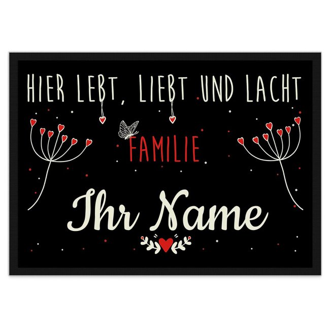 Liebevoll gestaltete Fußmatte in der Größe 60 x 40 cm mit fröhlichem Blumenmotiv und Spruch - Hier lebt