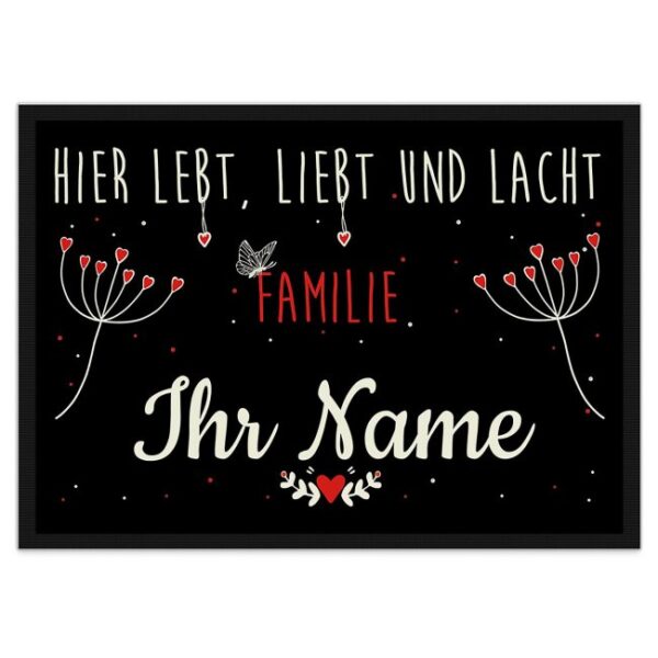 Liebevoll gestaltete Fußmatte mit fröhlichem Blumenmotiv und Spruch - Hier lebt