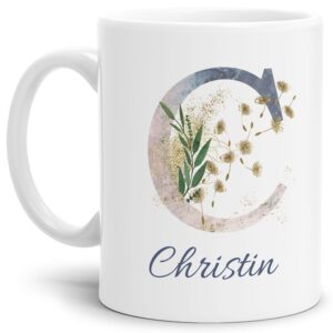 Liebevoll gestaltete Tasse mit Buchstabe und Name verziert mit einer Ranke aus Gräsern und Blumen. Der personalisierbare Kaffeebecher mit Monogramm...